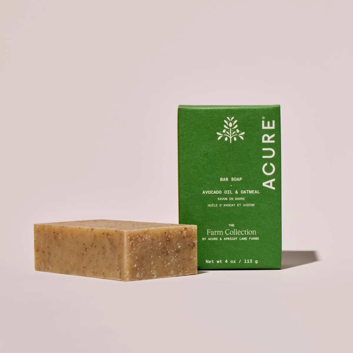Acure Farm Collection Avocado Oil & Oatmeal Bar Soap 113 g flecked sand-coloured bar beside its green paper box