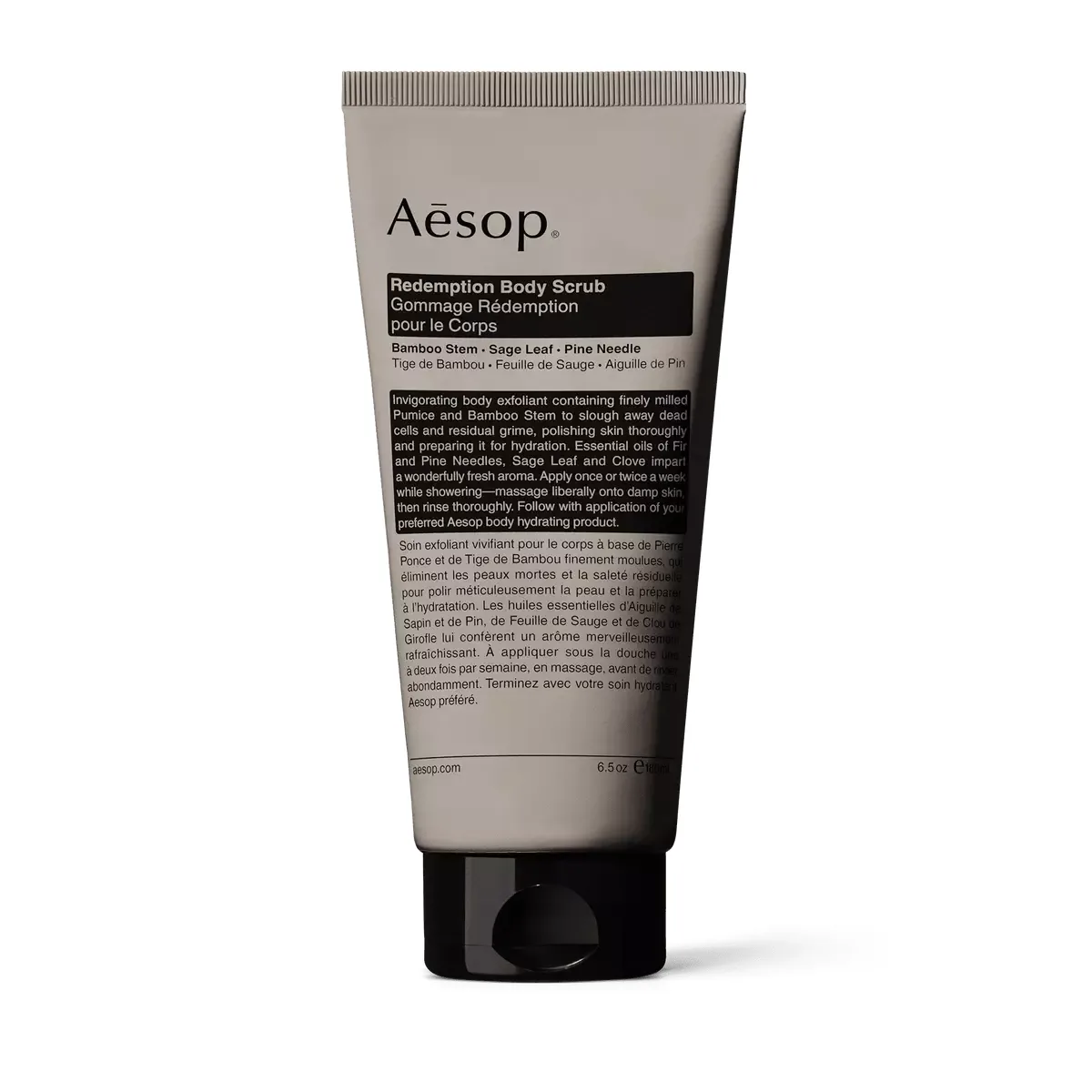Aesop Redemption Body Scrub taupe-grey tube with black flip cap, 180 mL
